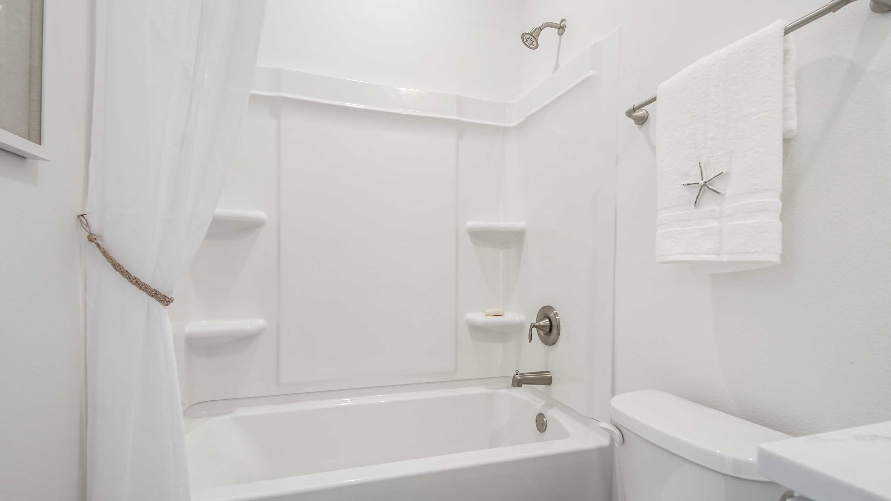 The second shared bathroom has a shower tub combination