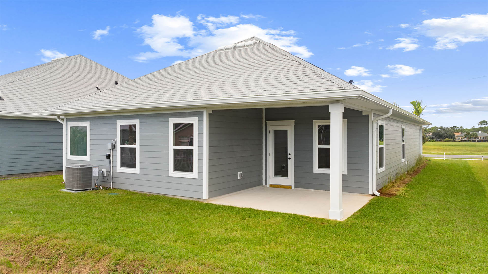 There is a covered patio at the back of the home with space for a dining area