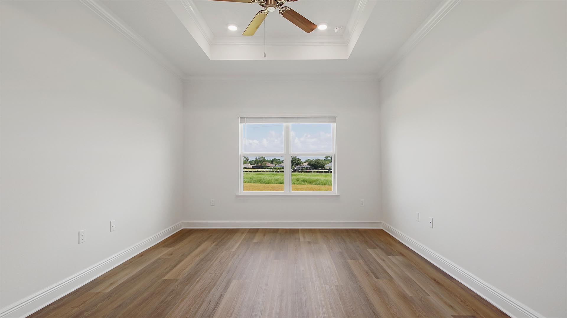 The primary bedroom is located off the living area and features EVP flooring