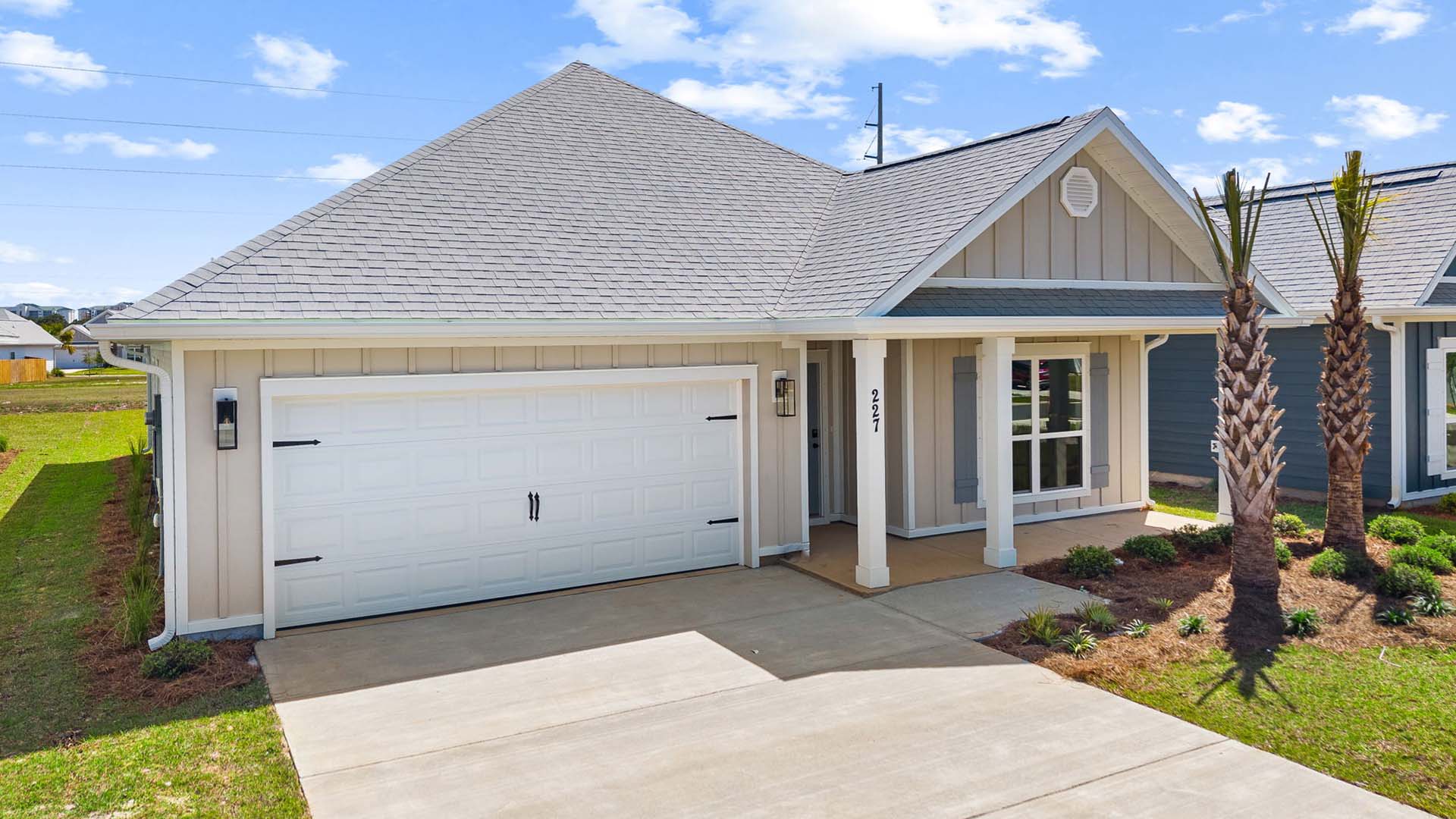 This home has a covered front porch and a two car garage