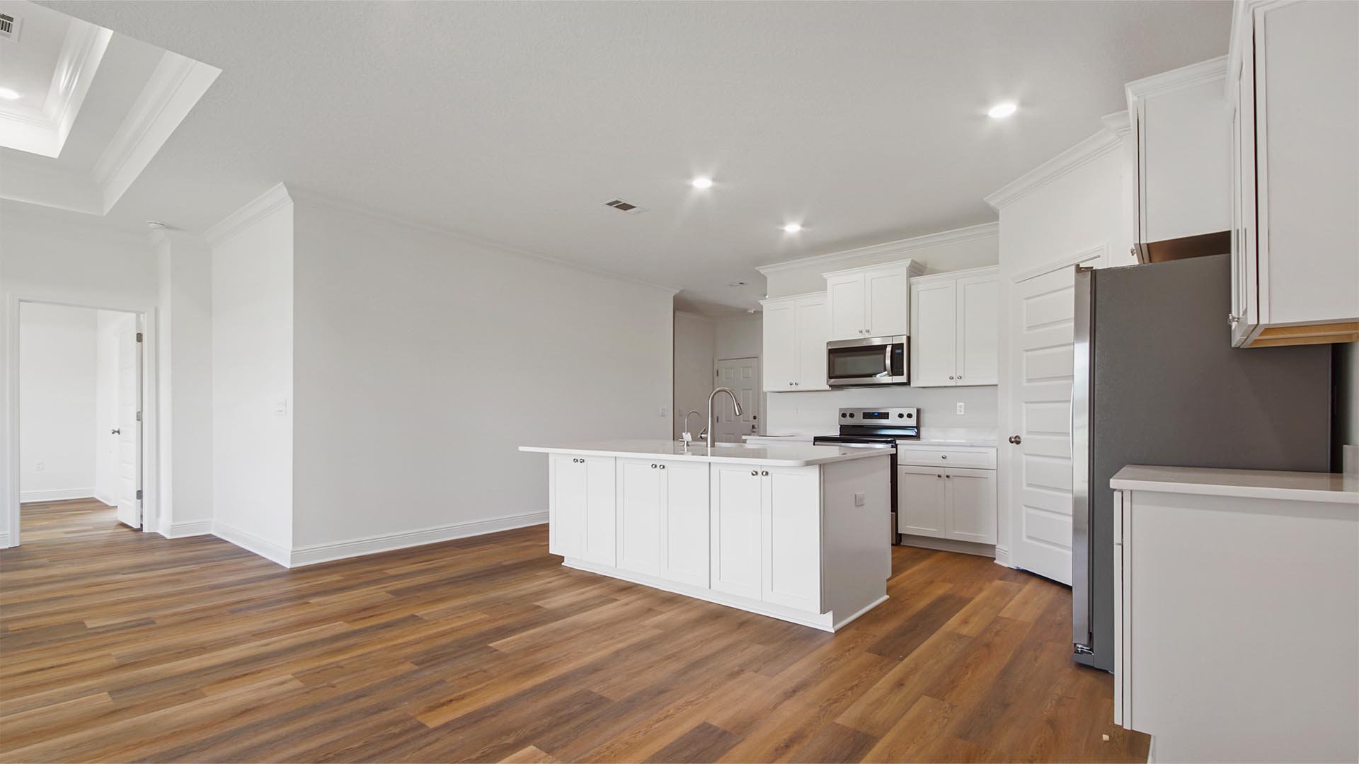 The kitchen overlooks the living and dining areas