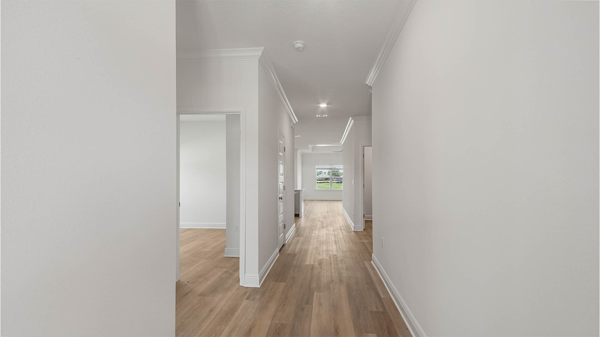 Front door entrance in foyer by bedroom and bathroom.