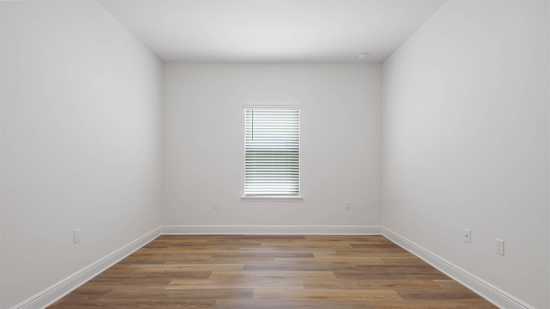 Bedroom four with EVP flooring and window.