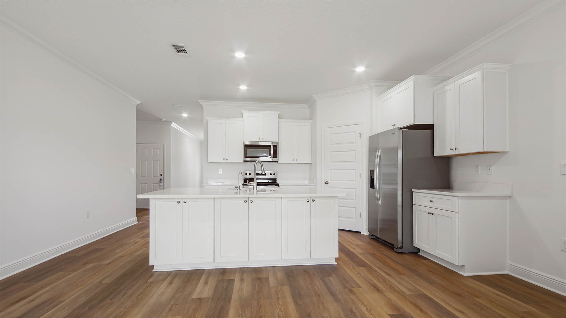Kitchen island with storage and bar seating.