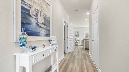 The Palm townhome has a bright entry hall that leads to the open living area