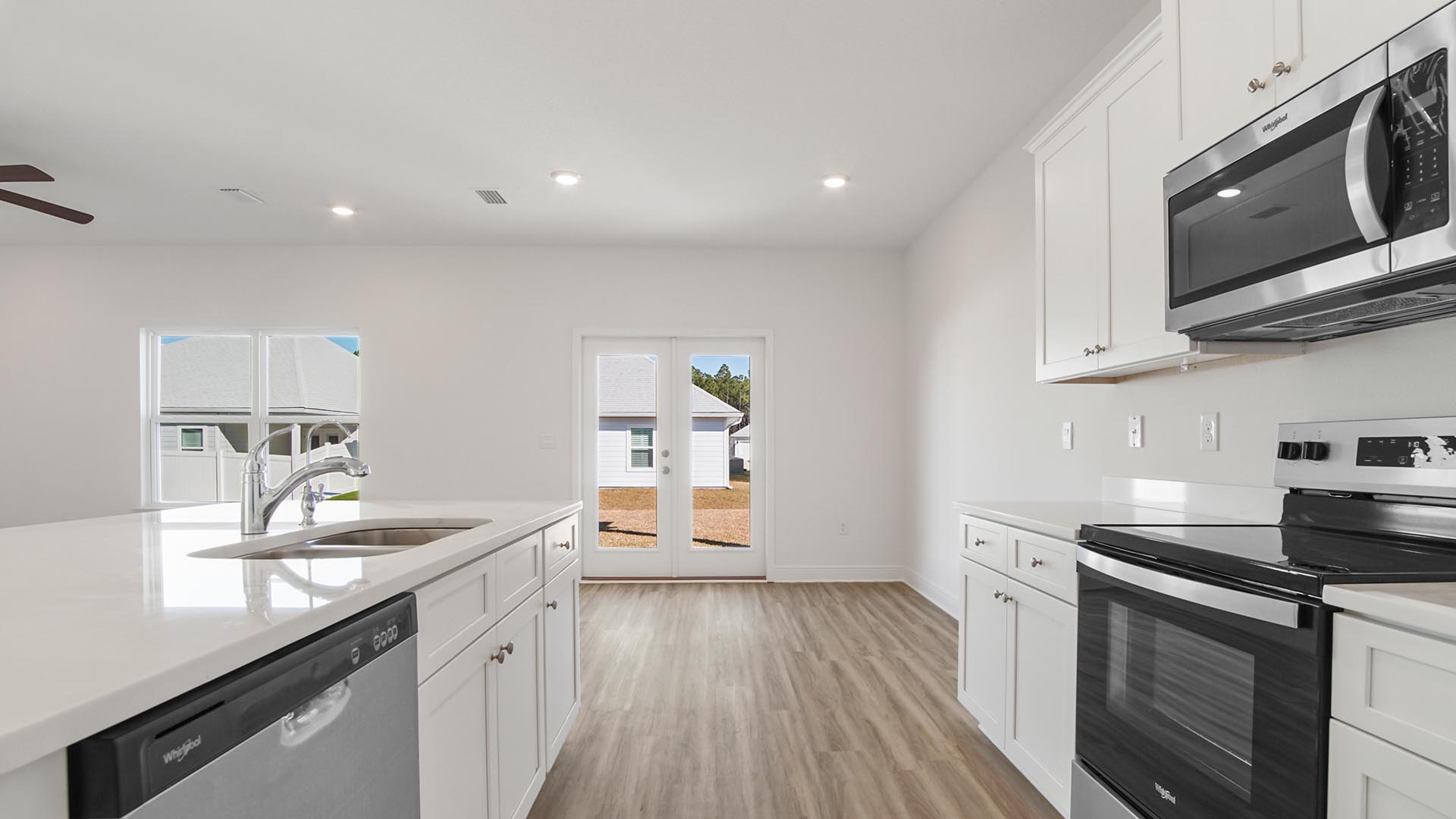 The kitchen overlooks the living and dining areas