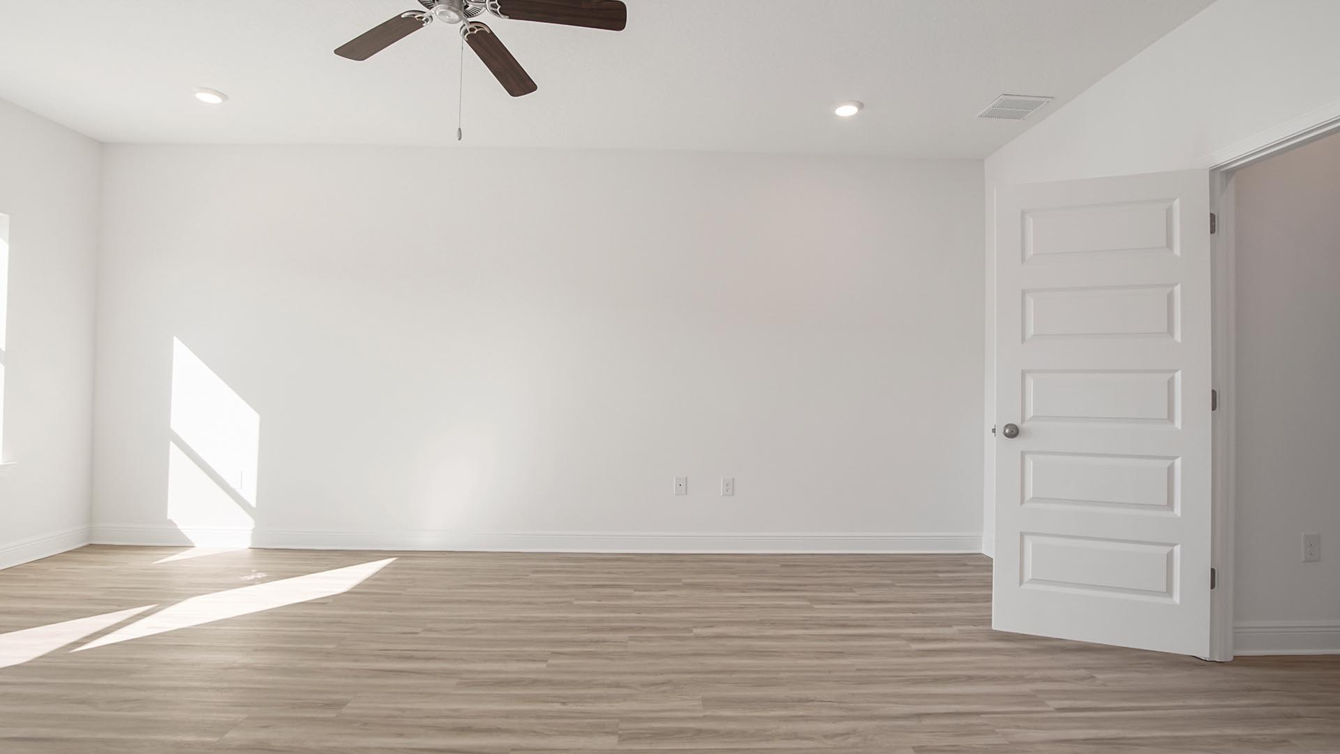 The primary bedroom has EVP flooring