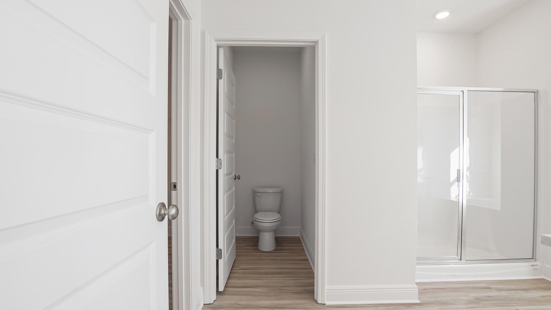 There is a separate water closet in the primary bathroom