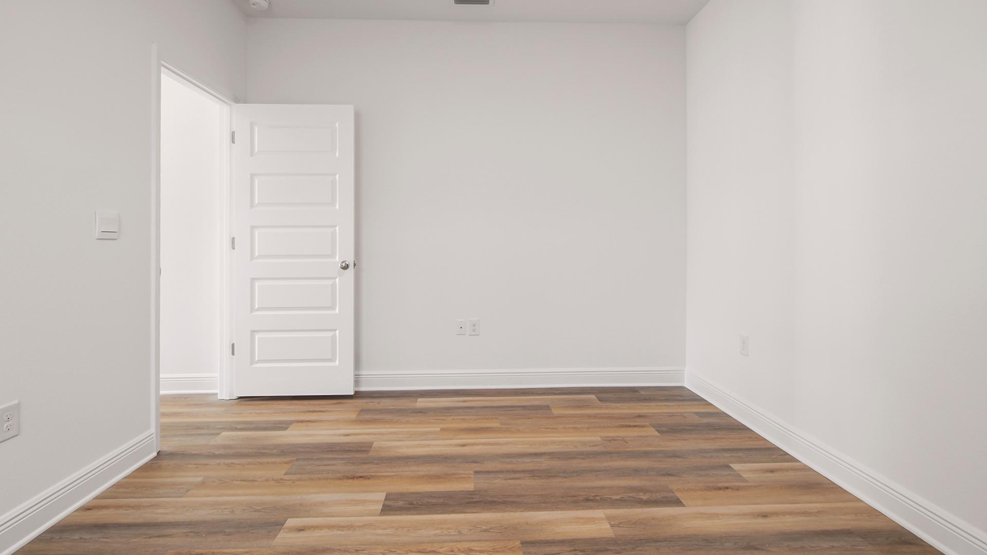 Bedroom three has EVP flooring