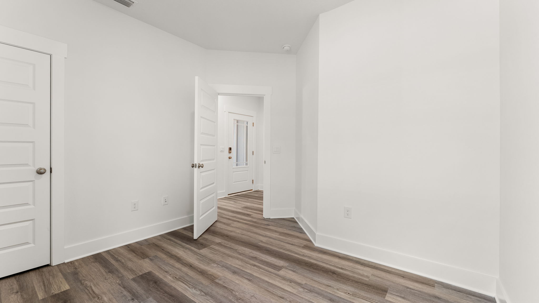 Guest bedroom three has EVP flooring