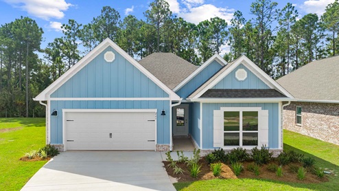 The Kennedy exterior has Hardie siding and a two car garage with covered front entryway