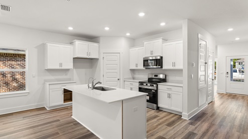 Each kitchen is designed with beautiful white cabinetry and quartz countertops