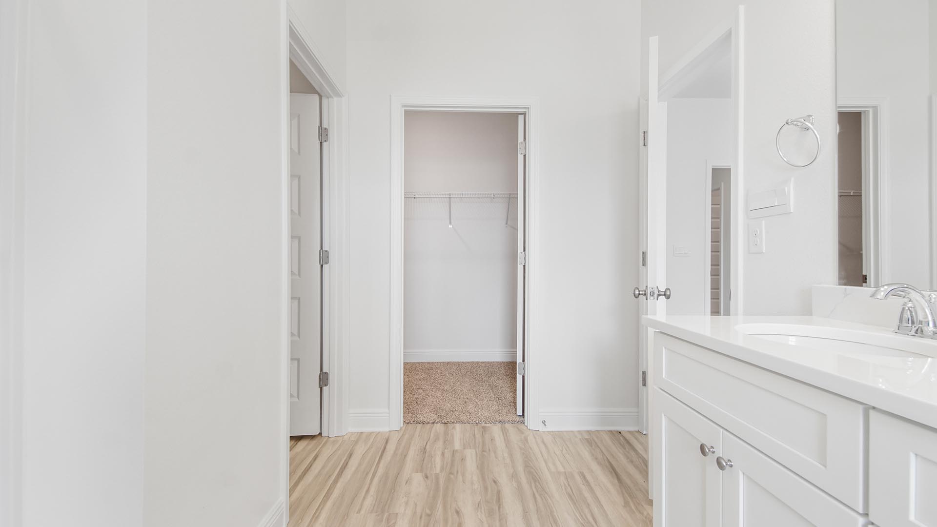 The primary bathroom has EVP flooring and a large closet