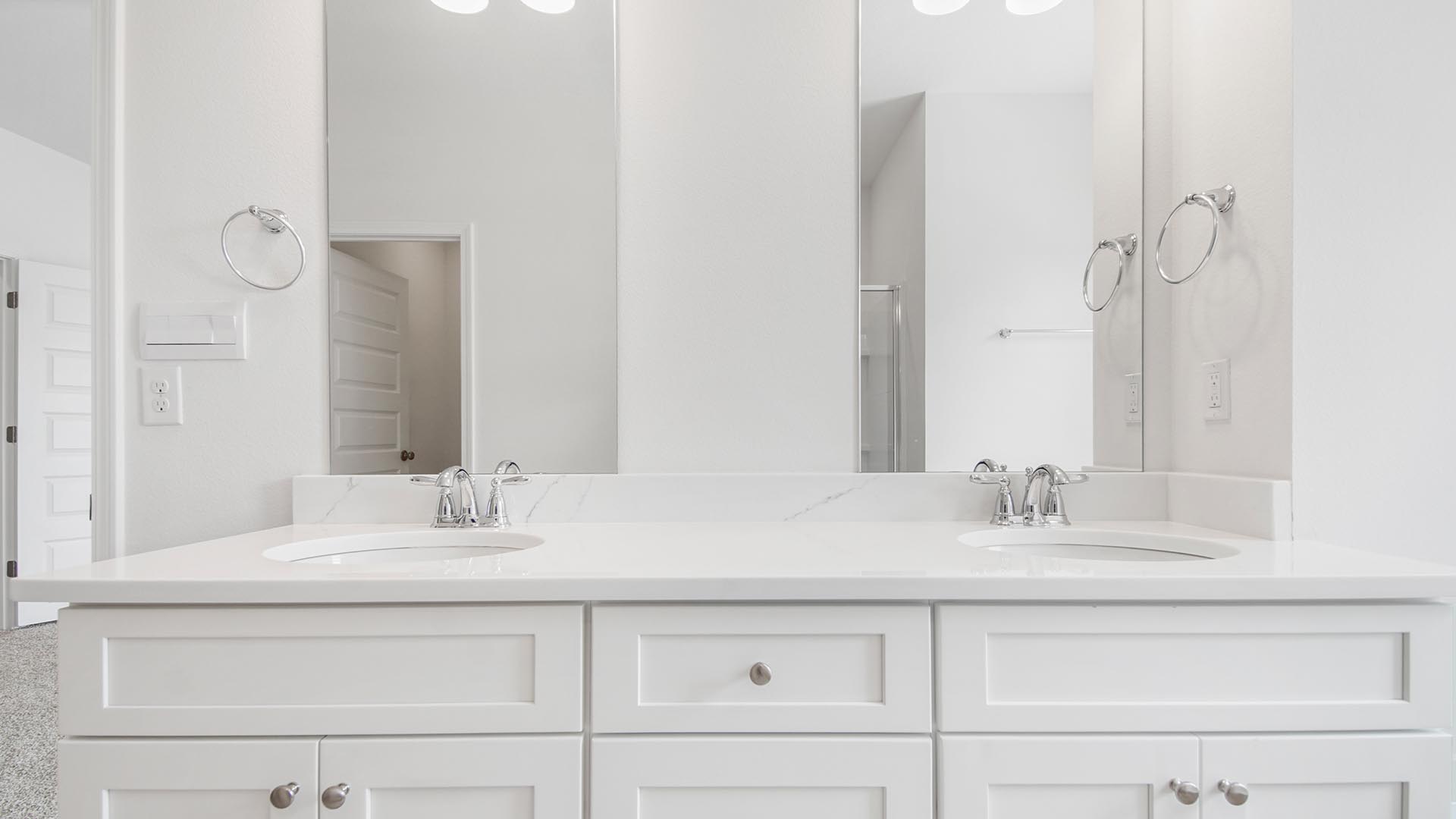 Dual sink vanity with lower cabinetry and quartz countertops