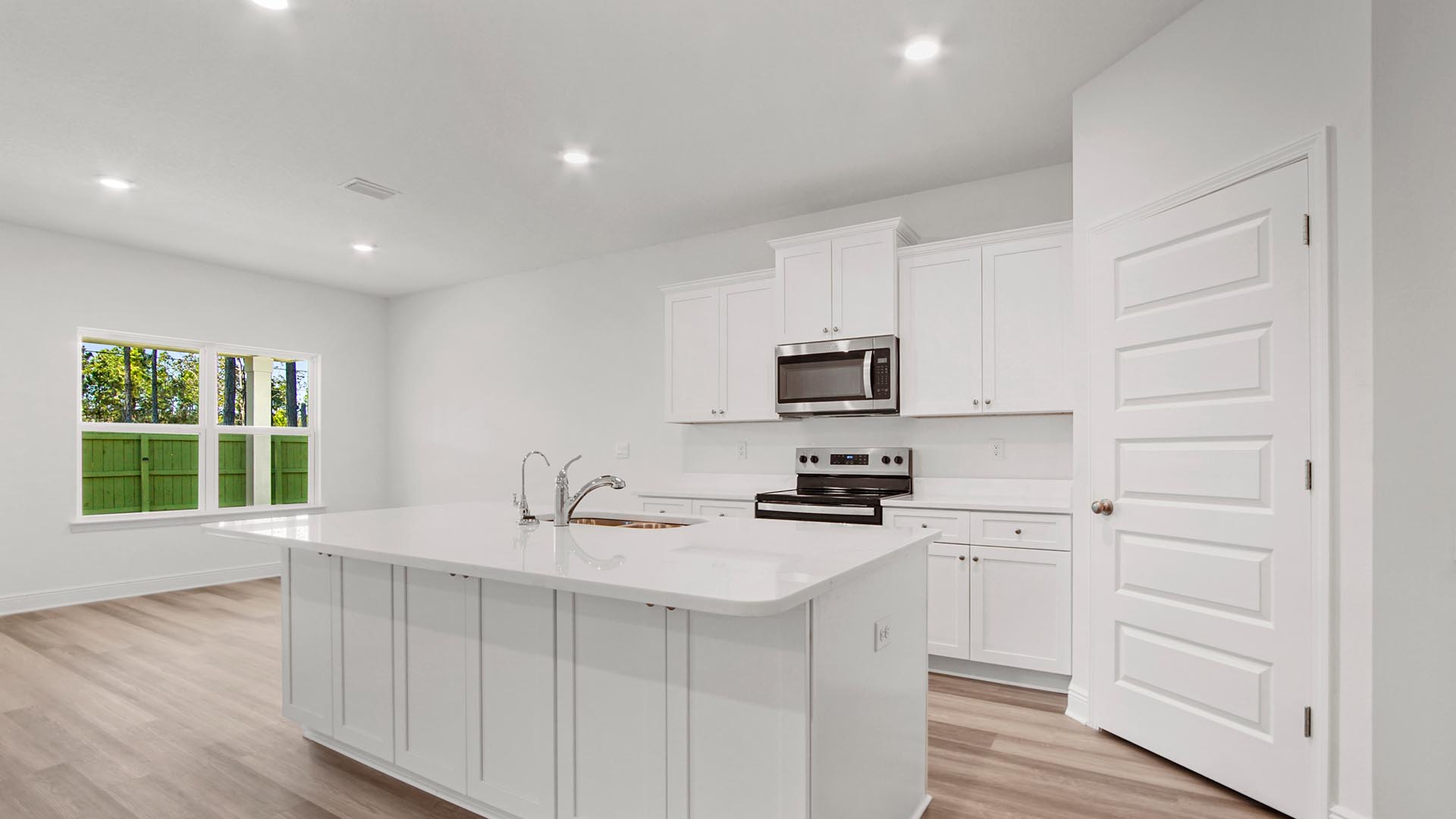 Open kitchen with center island and adjacent dining area