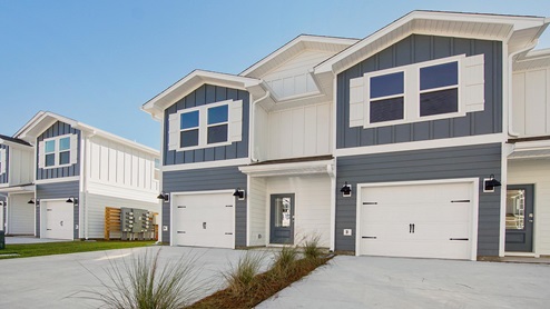 The Palm townhomes have two stories with a single car garage and three bedrooms and two and a half bathrooms