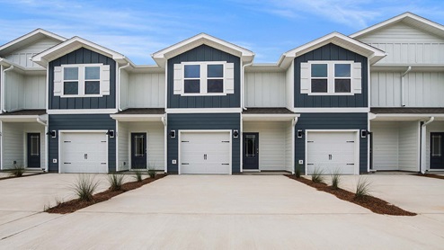 The Palm townhomes have interior units with windows at the back the townhome and the end unit with windows along the side
