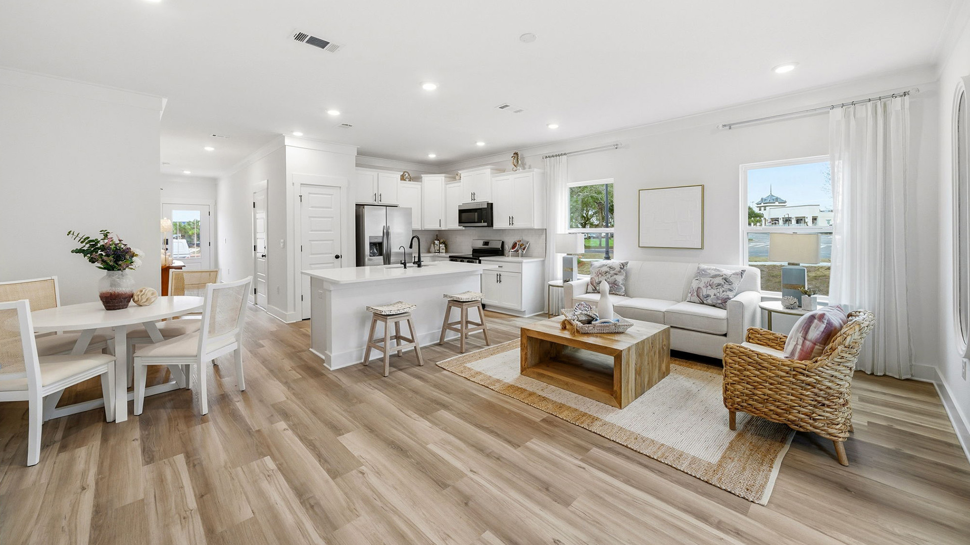 The spacious living area of the end unit at Palms Street Townhomes is illuminated by the