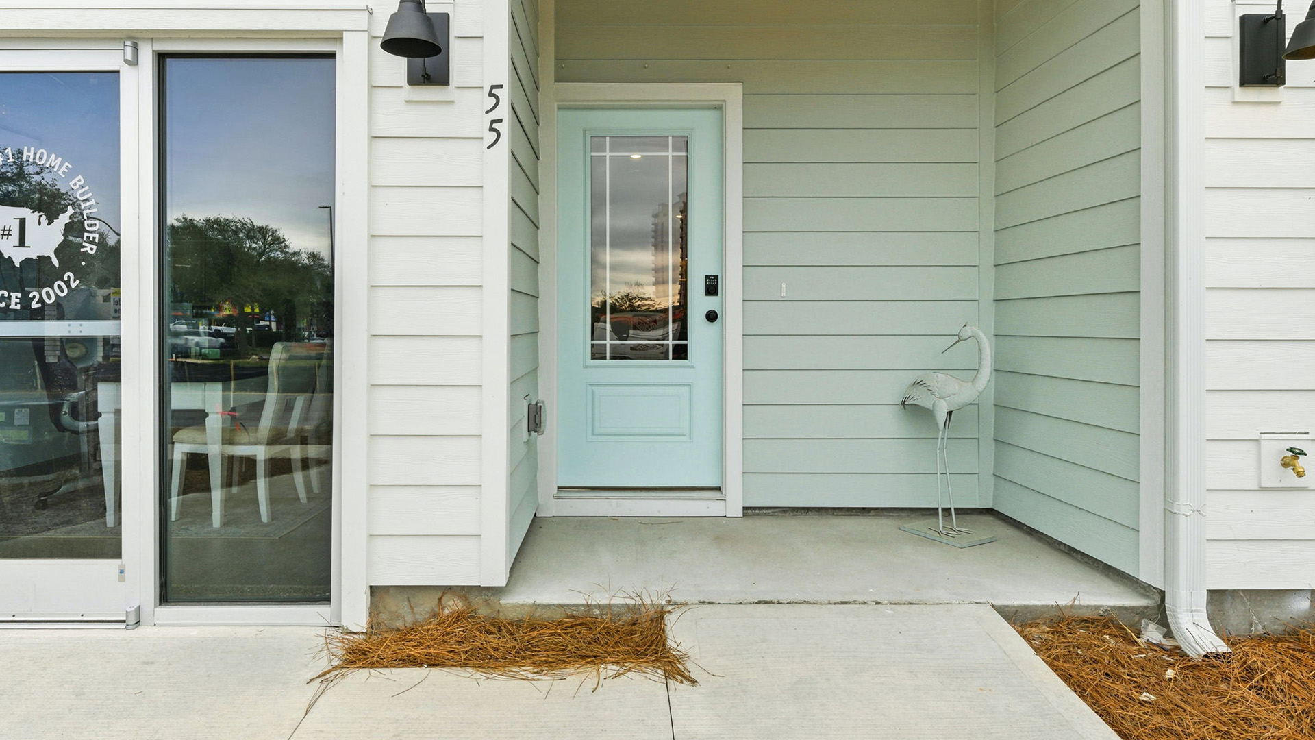 The entry to the unit is covered and there is a landscaped area between each unit