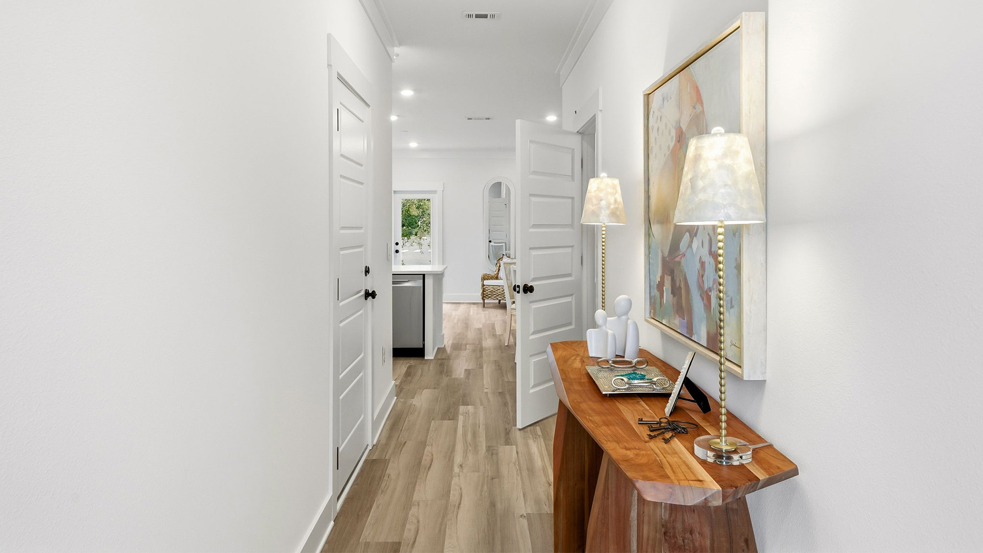 The entry hall leads to an open main level living area.