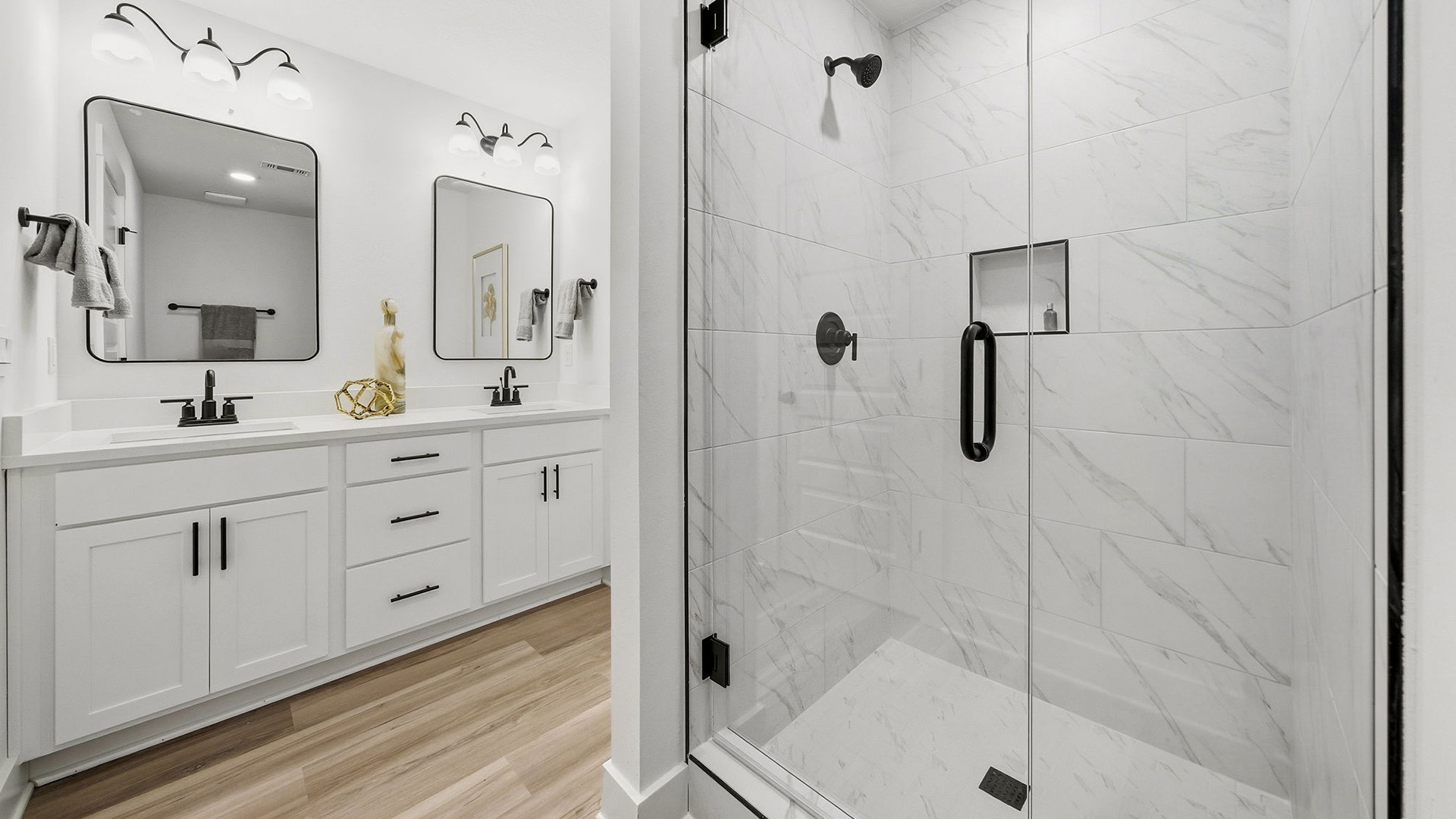 The primary bathroom has a shower with glass enclosure