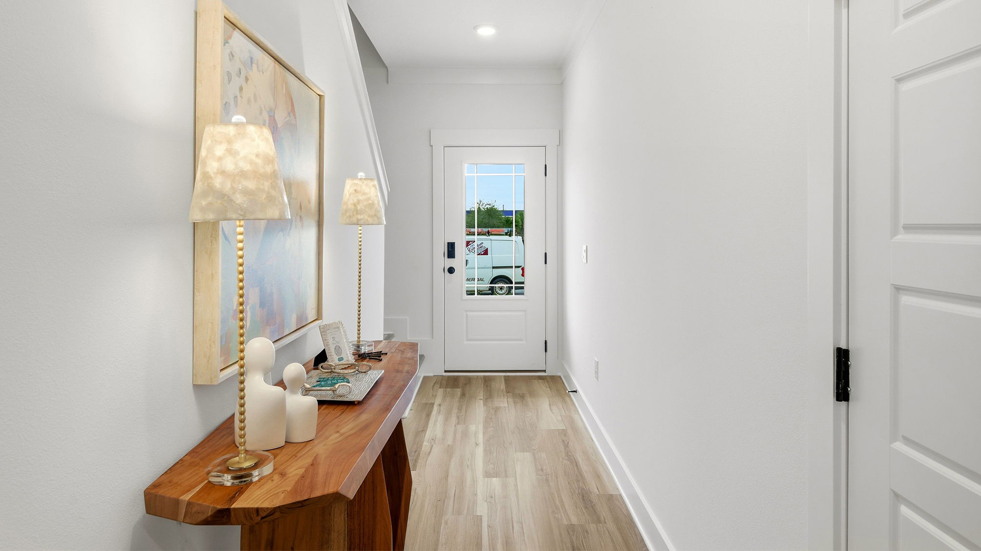 The Palm end unit has bright entry hall with glass prairie style door