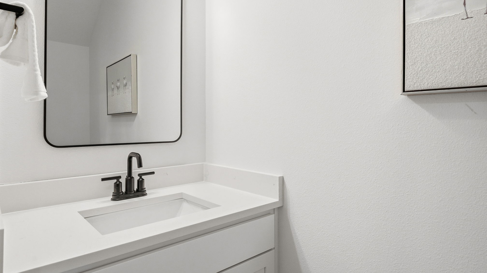 The shared bathroom has a single vanity