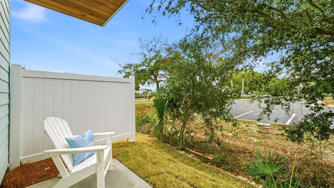 There is a back patio with a partition between units