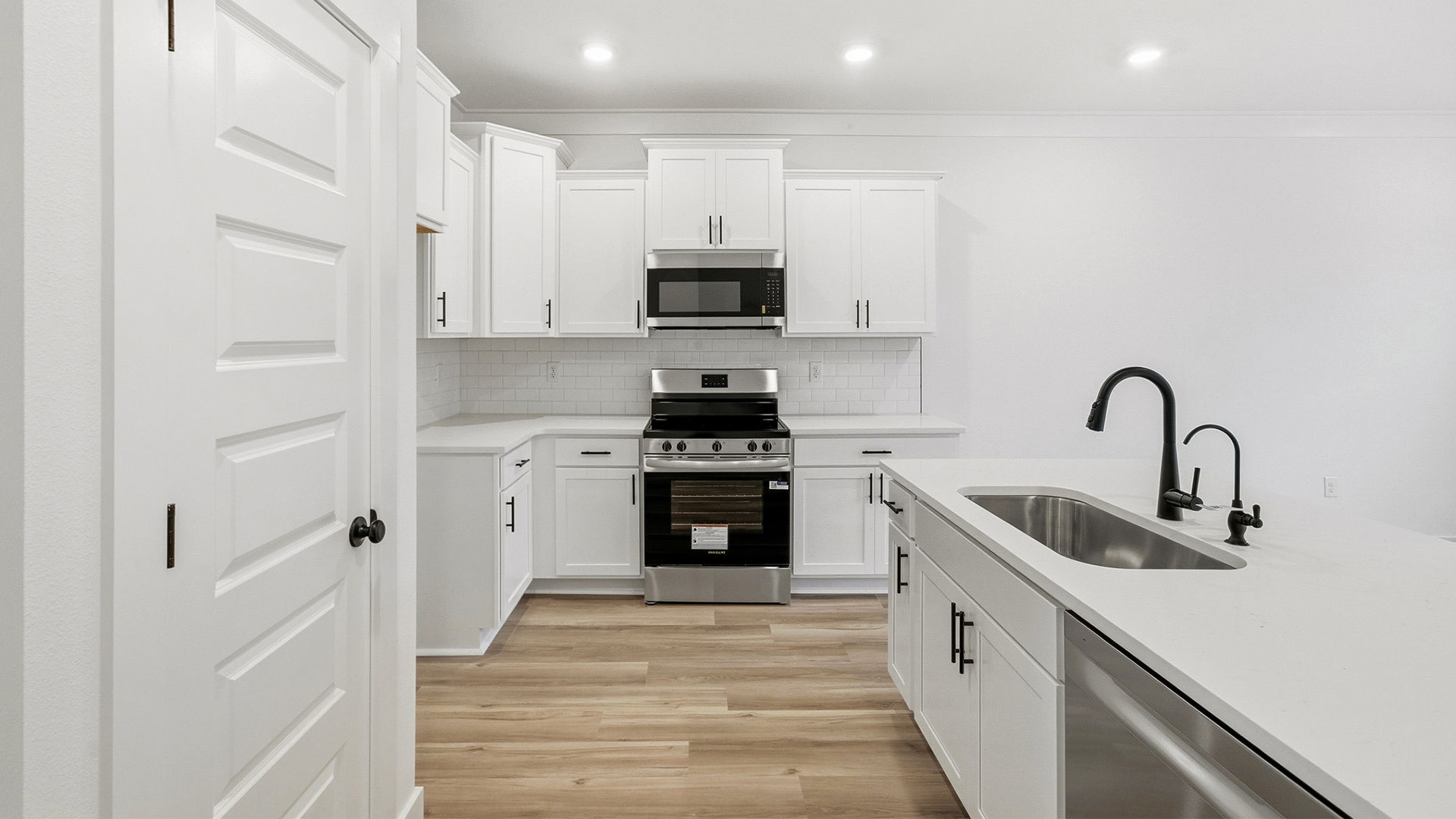 The entry hall opens to the spacious kitchen