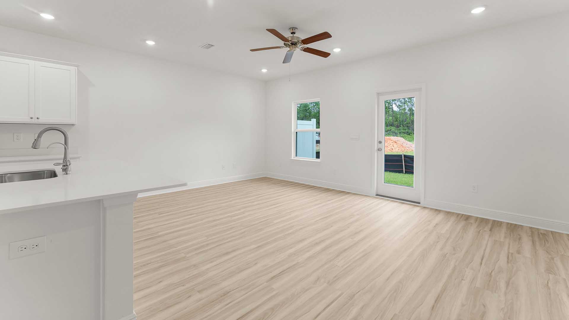 The living area is open and has space for a full living room suite