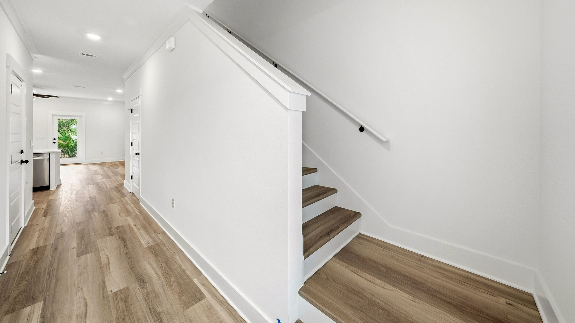 The stairs to the second level are at the front entry