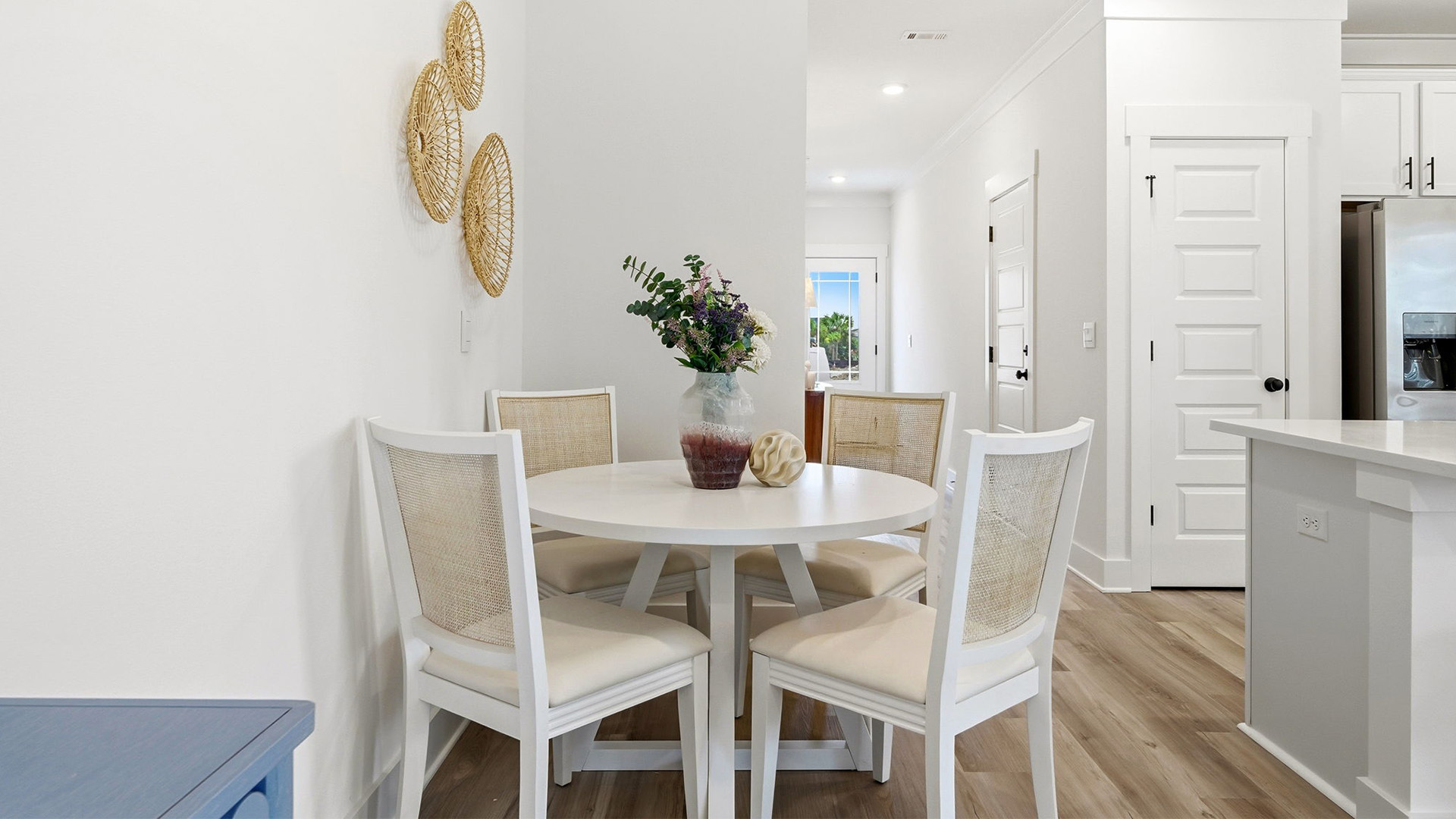 The dining area is a comfortable fit for a table and four chairs
