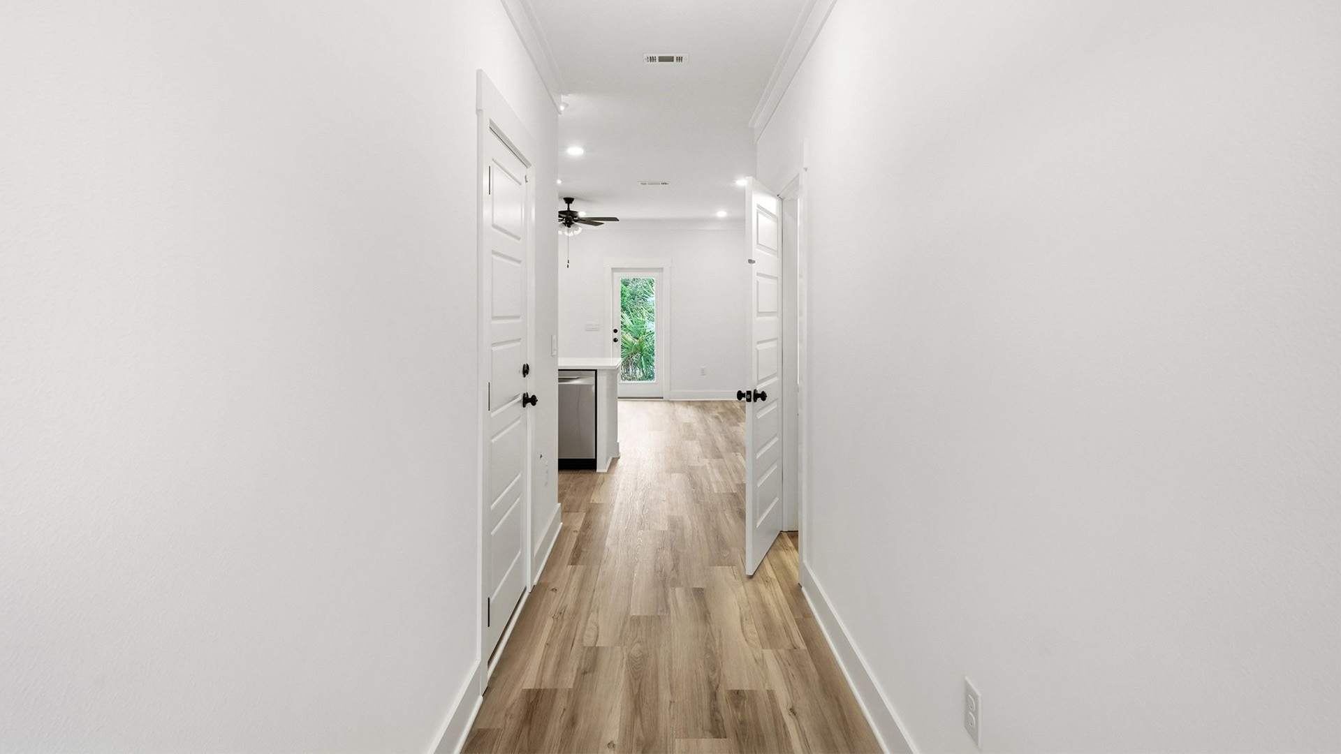 The entry hall is bright with a glass prairie style door