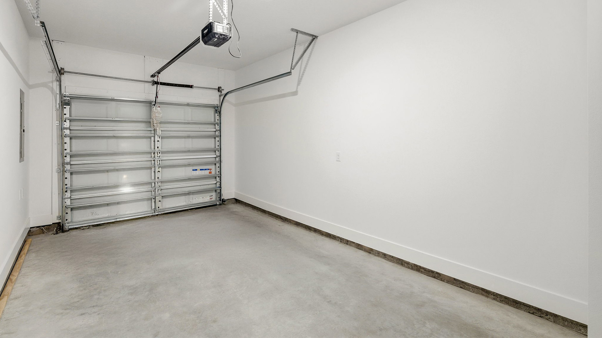 A single car garage is accessible from the entry hall