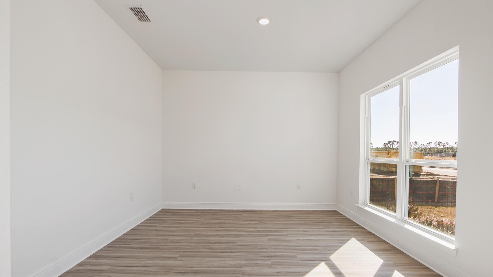 Sitting room with EVP flooring and large picture window