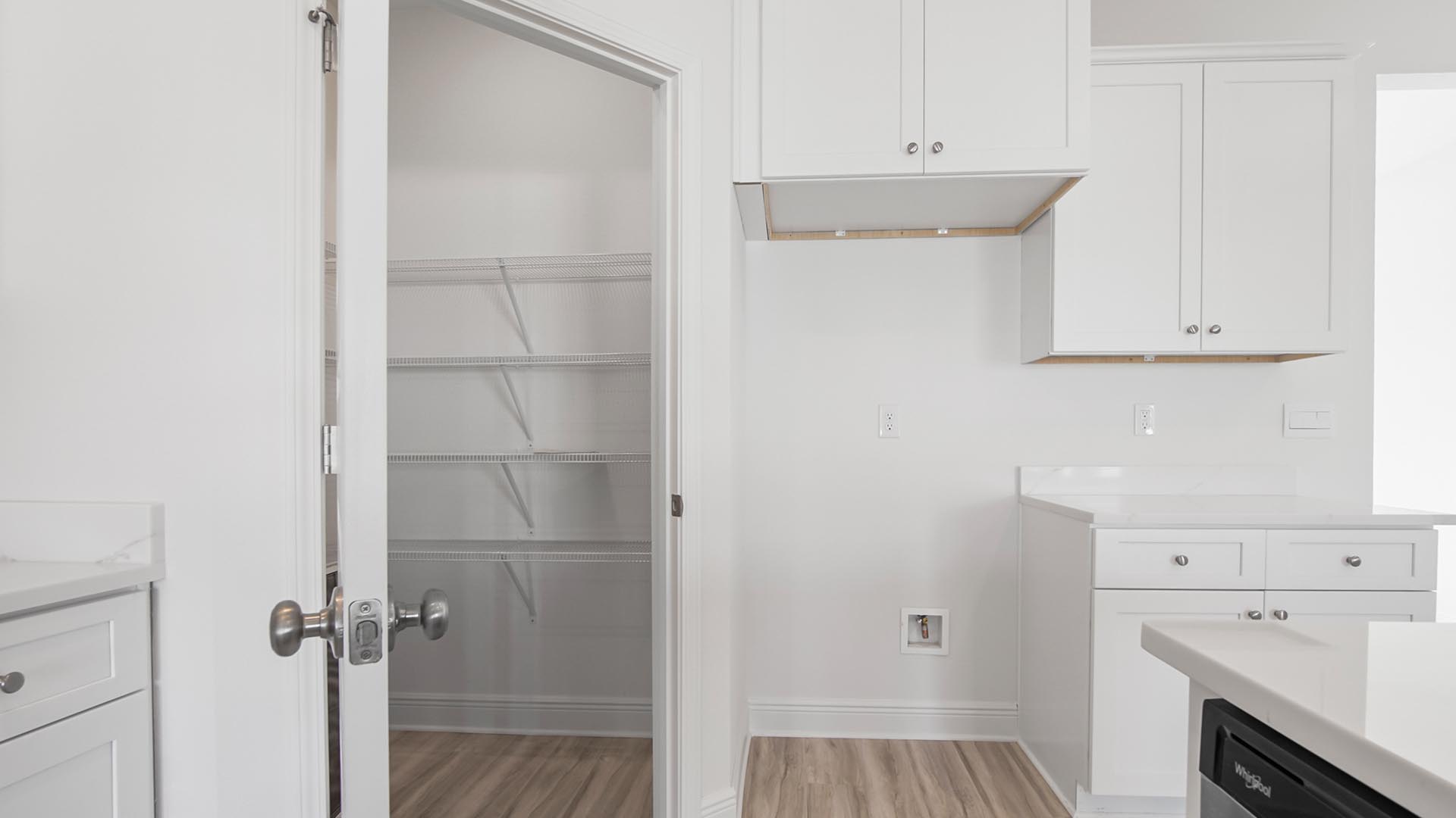 There is a corner pantry in the kitchen