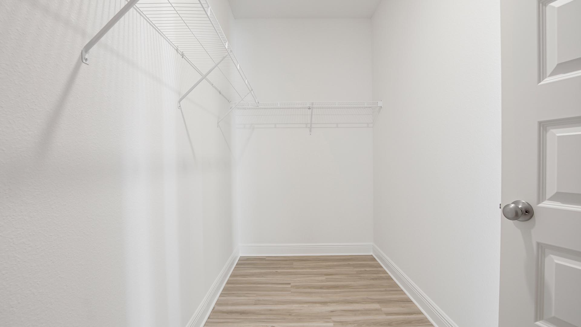 The large closet has upper shelving