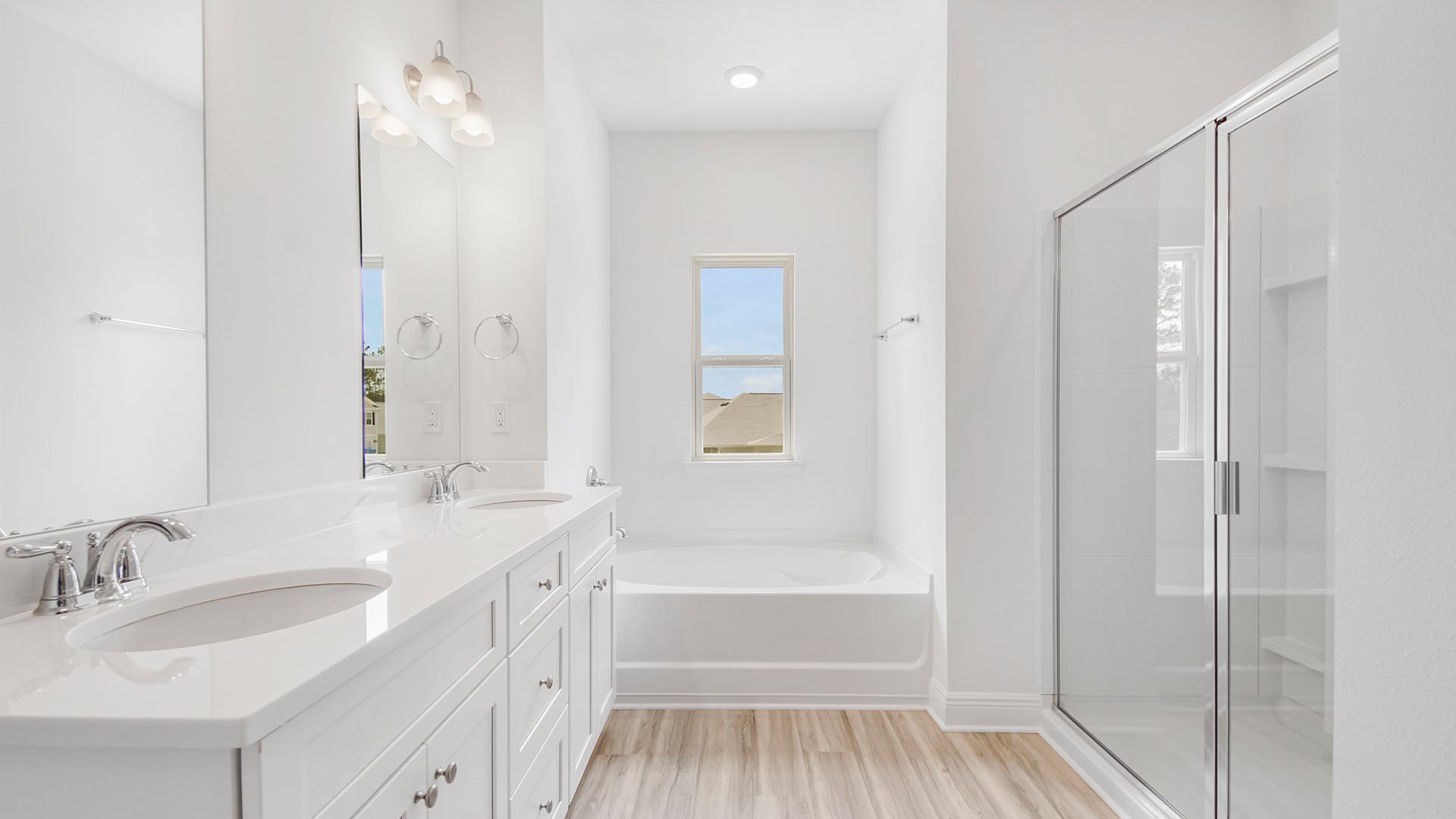The primary bathroom has a shower and separate tub