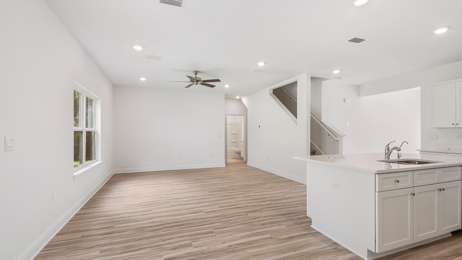 The kitchen overlooks the living and dining areas