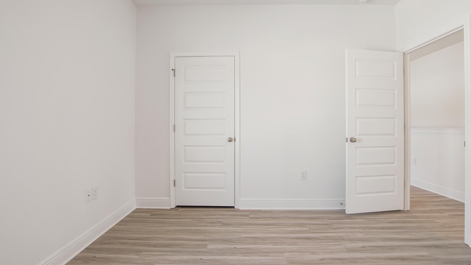 Guest bedroom three on the second level has carpet