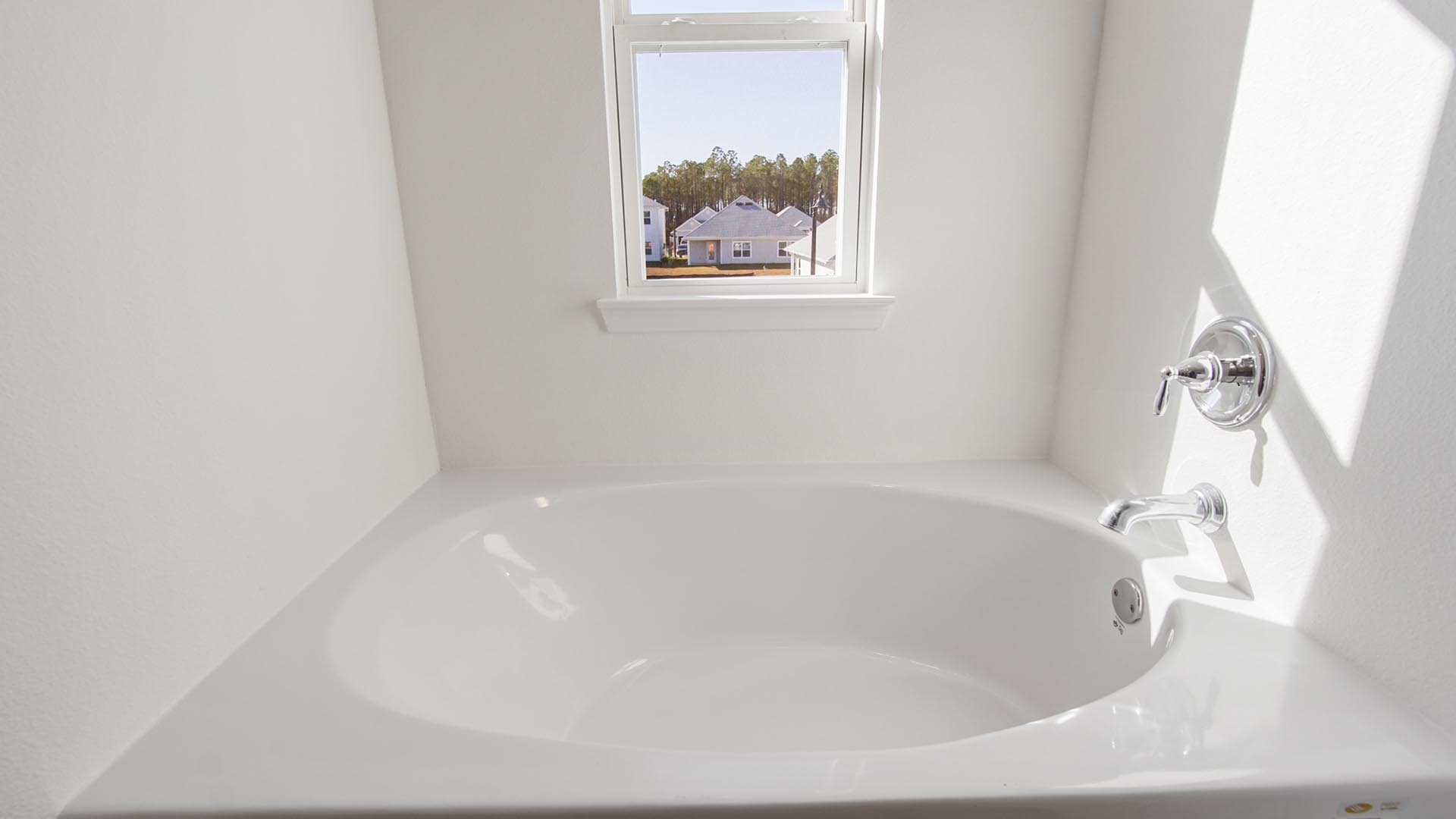 The primary bathroom has a soak tub