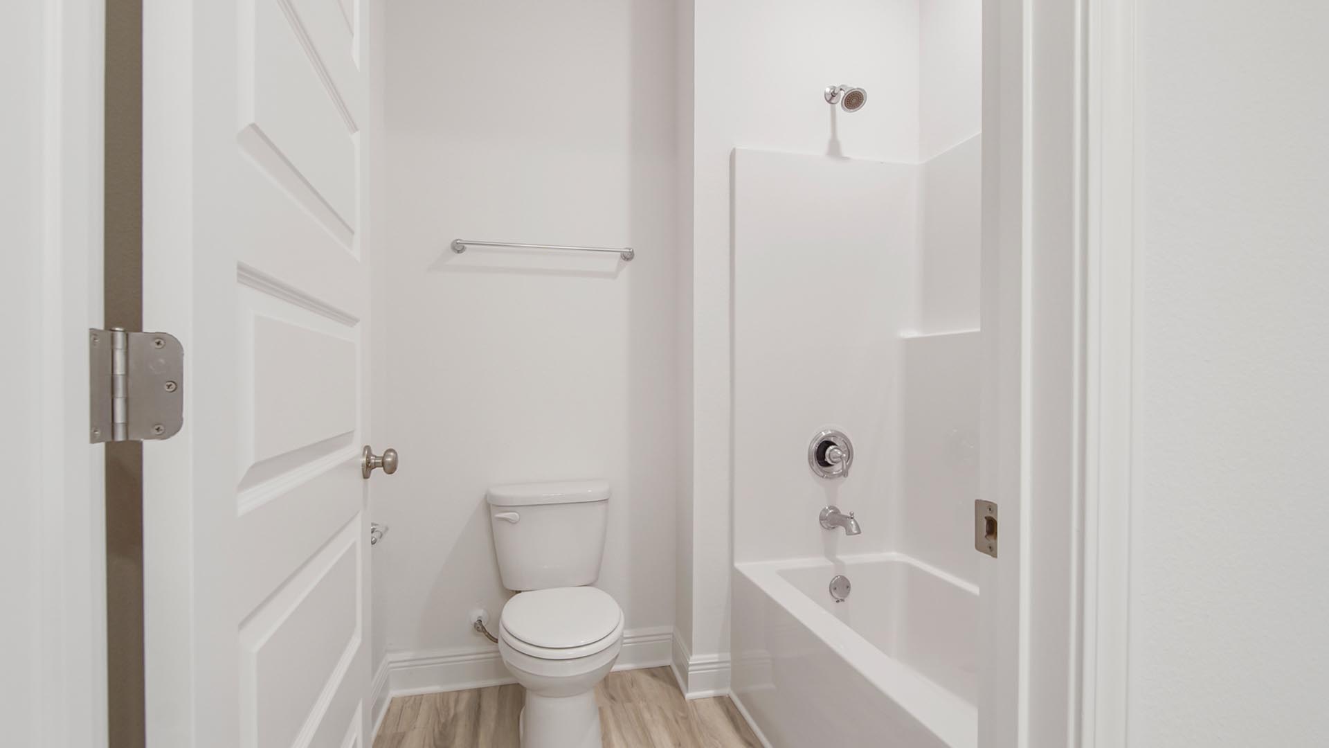 The shared bath has a shower tub combination