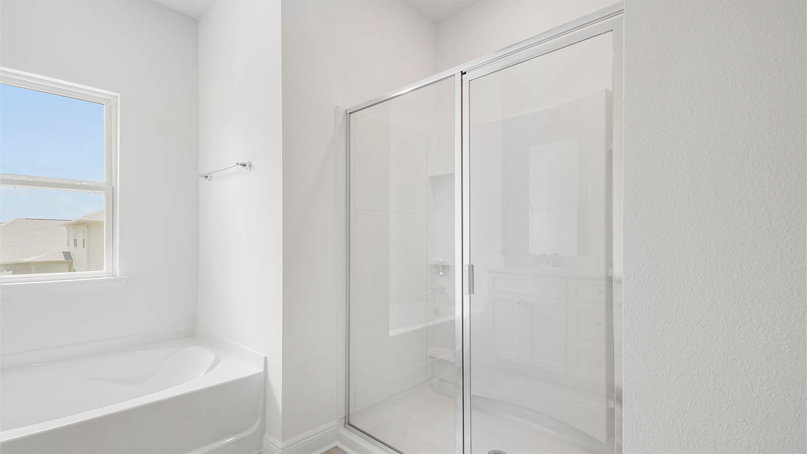 Primary bathroom with separate standing shower.