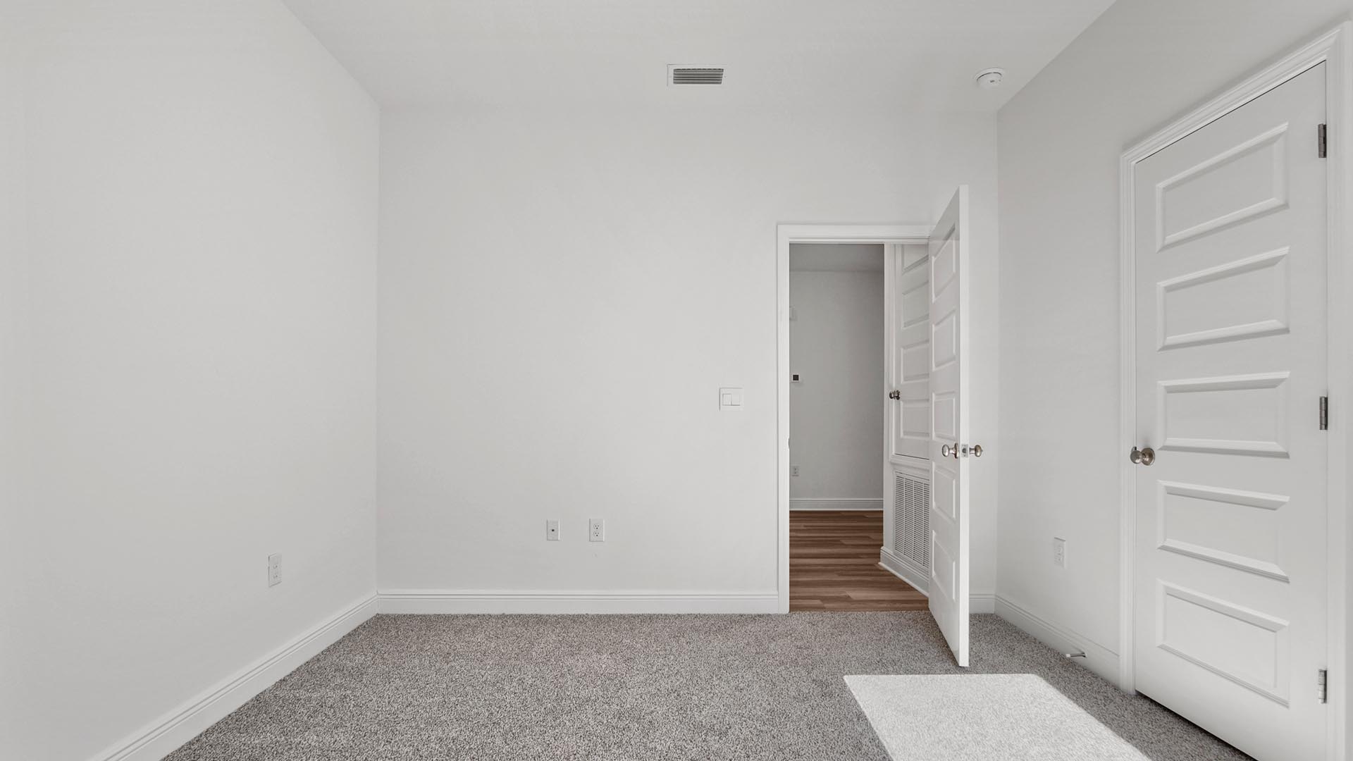 Bedroom four is spacious and features carpet