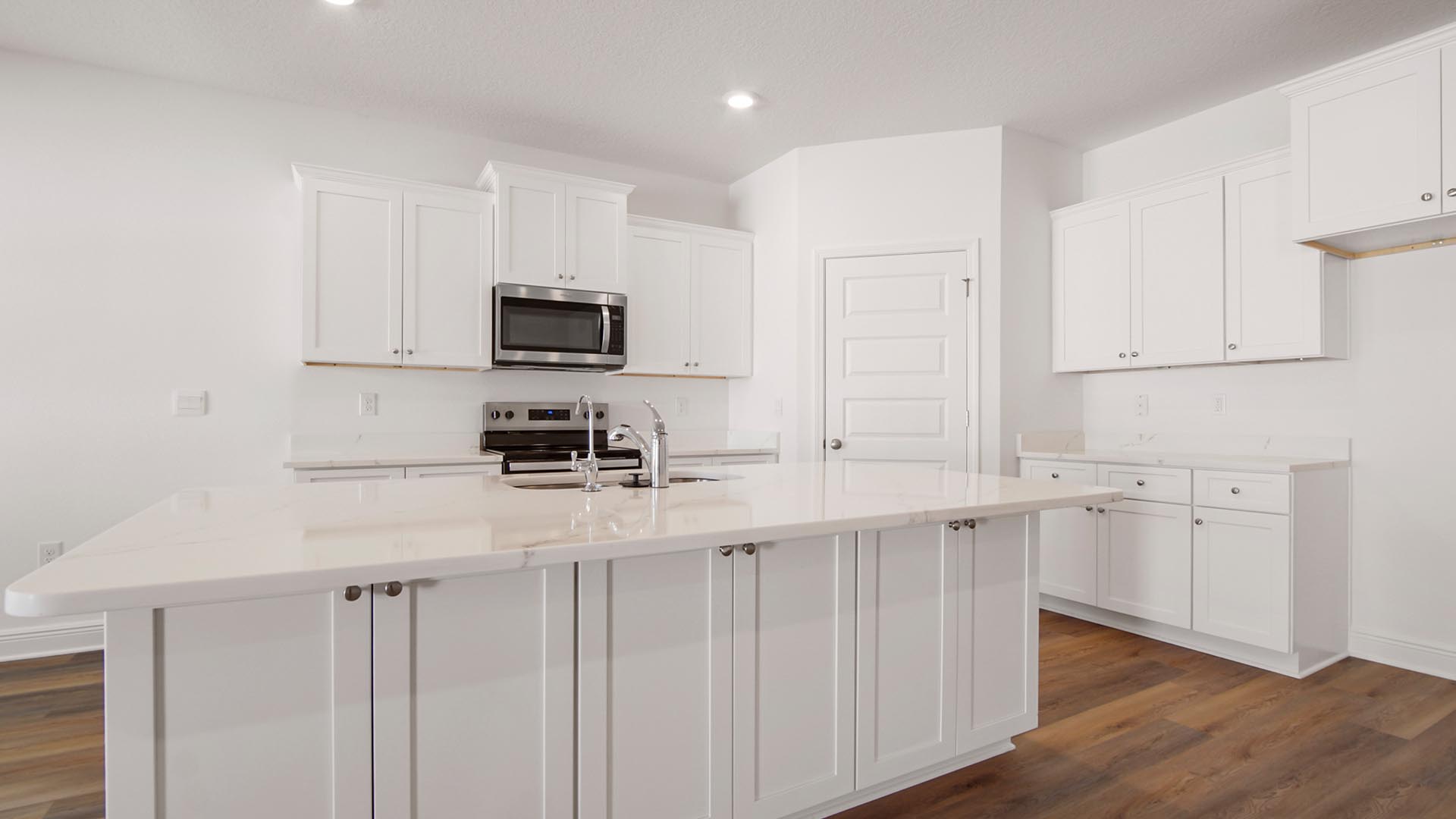 The kitchen has a center island with space for bar seating