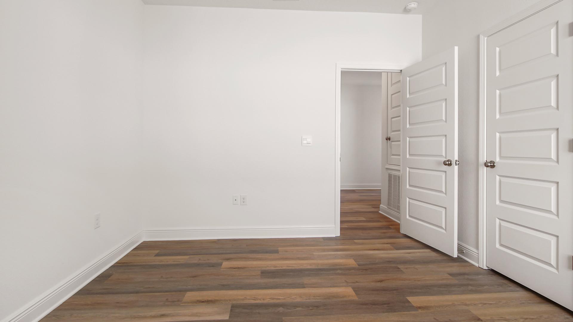 Bedroom three has EVP flooring