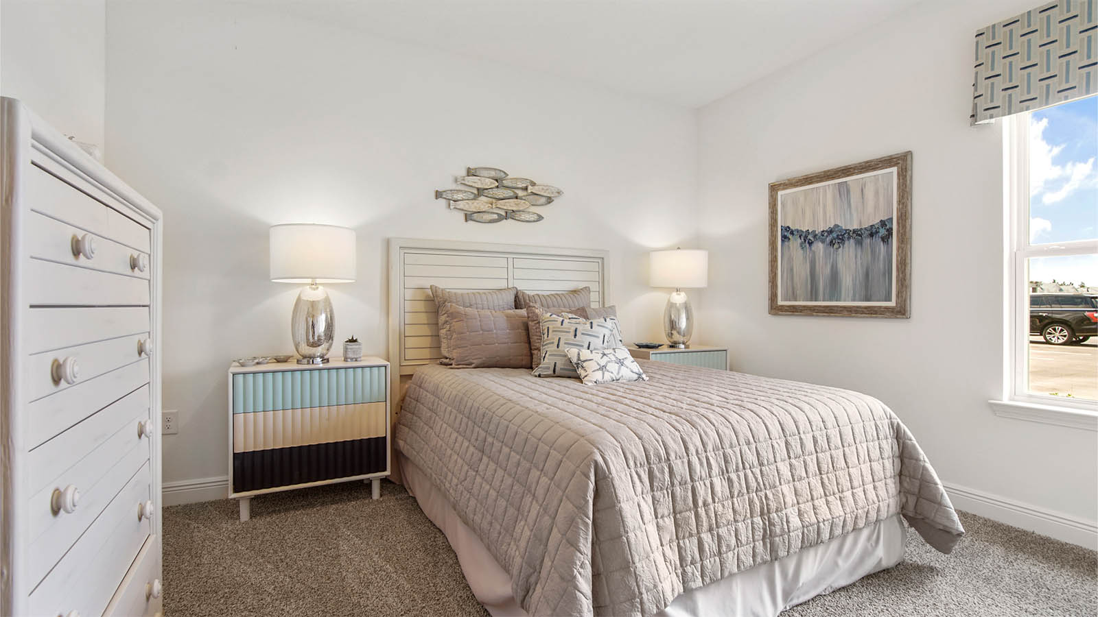 Bedroom two with window and carpet flooring.