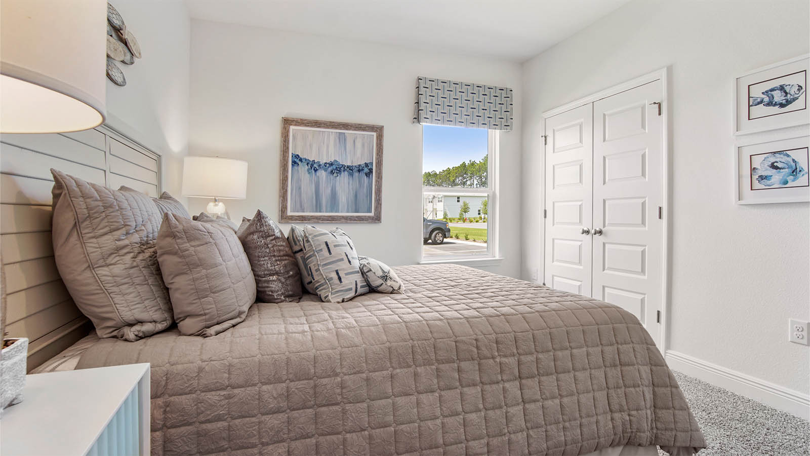 Bedroom two with window and double door closet.