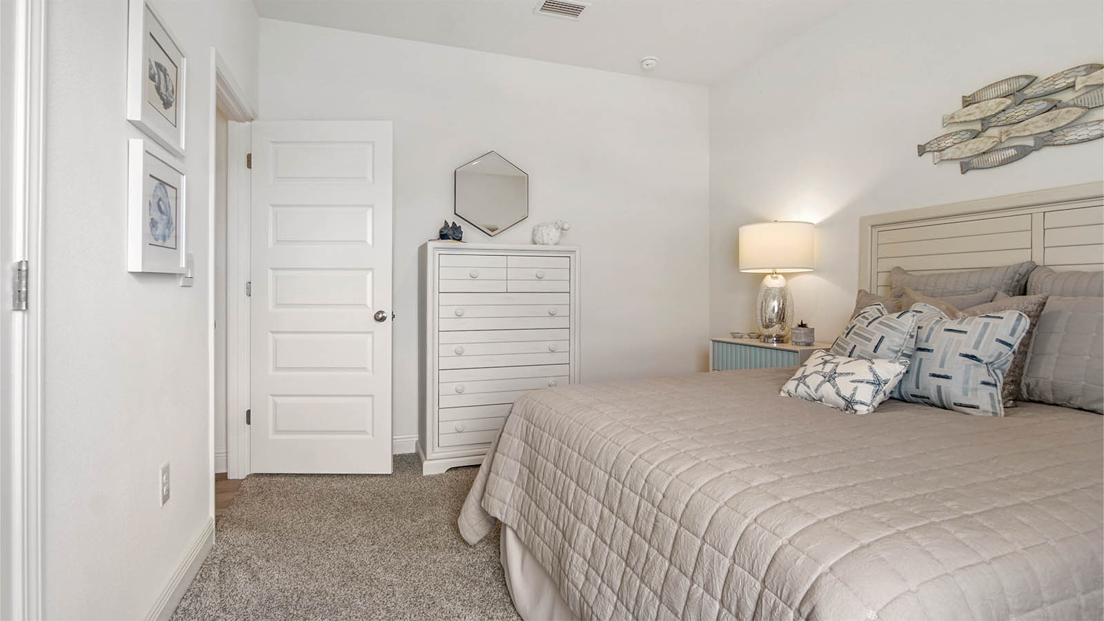 Bedroom two with carpet flooring and double door closet.