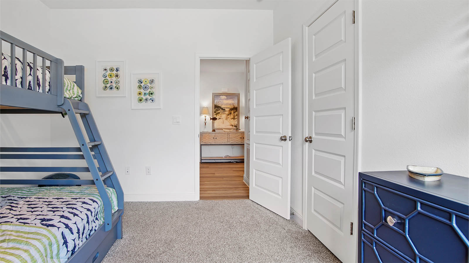 Bedroom three with carpet flooring and closet.